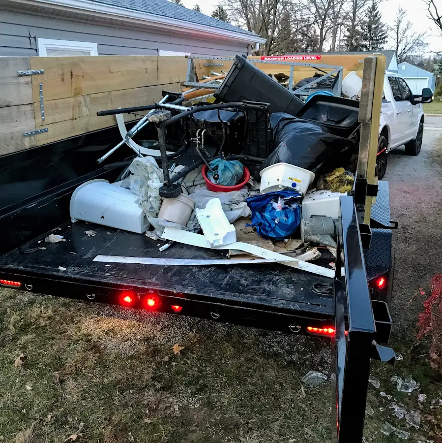 Roll-off dumpster delivered to a residential driveway in Howard